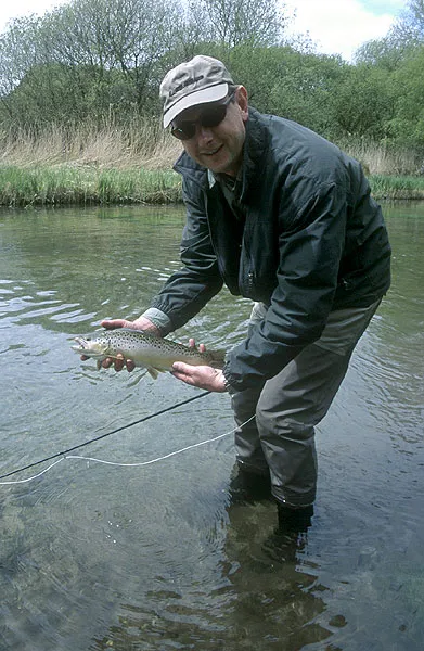 Ready to release - Paul is ready to let a Test brown trout return the the clear water.