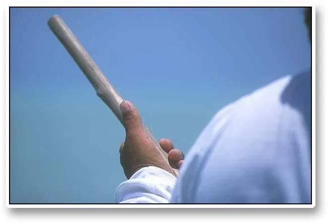 Thumb, hand, pole - Severro's wooden pole is smooth from hours and days of poling fishers around.
