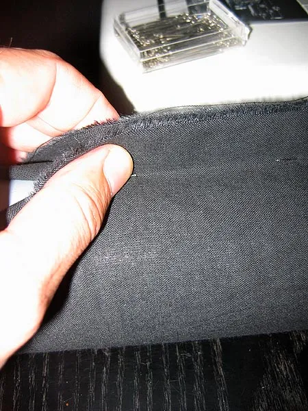 Pull - Pull the fabric together and stick in a needle parallell with the tube for every 10 centimetres or 4 inches.