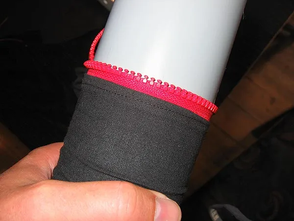 Zipper - The zipper should fit tightly around the plastic tube