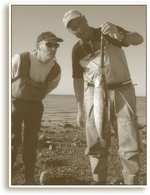 Weighing - Friend Uffe watches while friend Henning weighs a fish. This one was just under 2 kilos or 4 lbs. And yes, this fishing is purely catch & kill as described in the article.