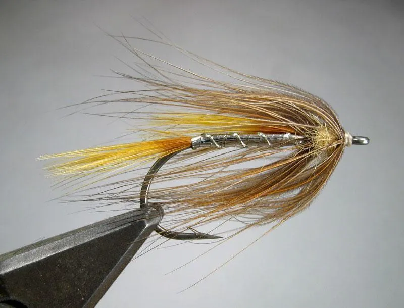 Umbrella - An Umbrella tied for sea run brown trout. The fly uses two yellow GP saddle feathers for tail and wing