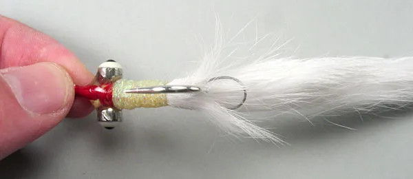 Wire loop - The wire loop keeps the long rabbit strip on the Poxy Bunny from swinging down and around the hook bend.