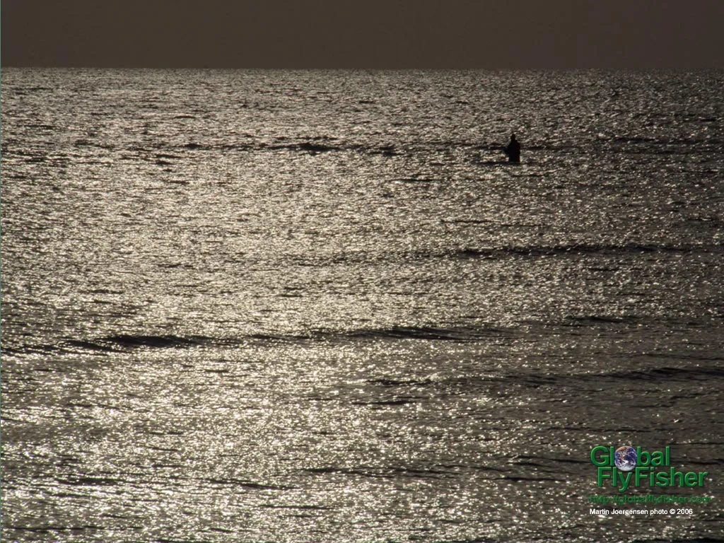 Computer screen wallpaper: Lonely angler on the big water.